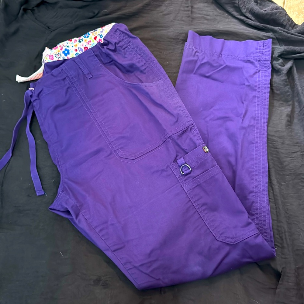 Koi plum purple scrub cargo style pants.